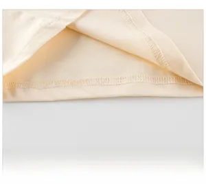 Detailed close-up of girls' cotton T-shirt hem showing high-quality double-needle stitching