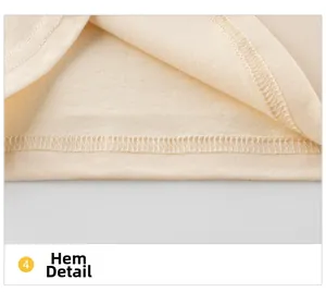 Nahaufnahme des doppelgenähten Saums am cremefarbenen Baumwollshirt mit feiner Struktur