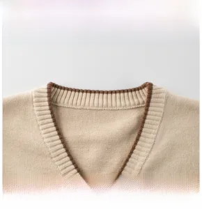 Detailed macro view of the V-neckline with brown contrast trim and rib-knit texture