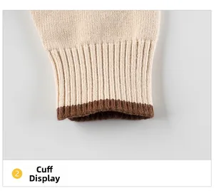 Detailed view of ribbed cuffs on children's knitted sweater in cream and brown