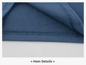 Détail de la couture double à l'ourlet d'un t-shirt bleu marine en coton pour enfant