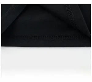 Detailed macro view of high-density cotton t-shirt hem with professional double stitching