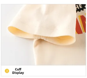 Close-up of the double-stitched cuff on a cream-colored cotton toddler short-sleeve T-shirt