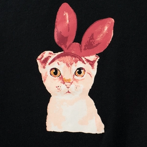 Kids black cotton T-shirt featuring a cute cartoon orange cat with rabbit ears print