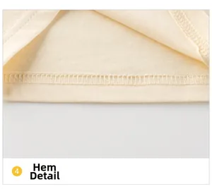 Détail de l'ourlet avec couture double aiguille de qualité sur tissu en coton beige