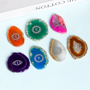 Chakra healing set with 7 natural agate slices featuring silver symbolic engravings