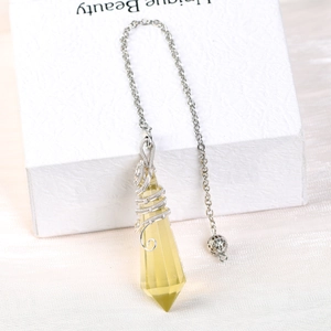 Faceted yellow crystal dowsing pendulum with handmade silver wire wrap and metal chain