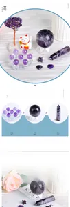 Macro shot of natural amethyst gift set including crystal spheres, towers and stars