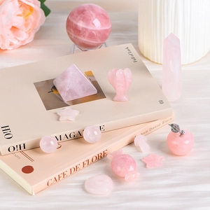 Natural rose quartz gift set with crystal sphere, pyramid and apple-shaped carvings