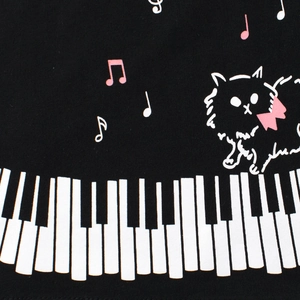 T-shirt nera per bambini in cotone con stampa di gatto, note musicali e tasti di piano