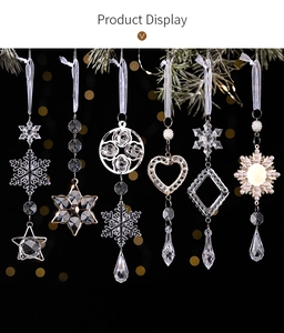 Macro detail of six acrylic Christmas snowflake and droplet pendants on a festive background