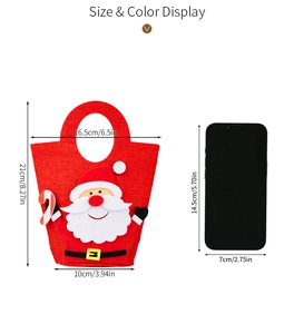 Christmas Santa gift bag with handle and phone scale reference showing 21cm height