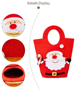 Detail view of Santa Claus gift bag showing embroidery, fabric texture and inside space