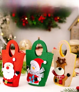 Detailed view of Christmas burlap gift bags featuring Santa, snowman, and reindeer designs