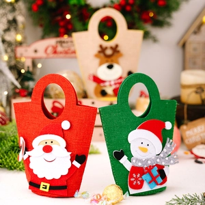 Detailed view of handmade felt Christmas gift bags with 3D Santa and elk patterns