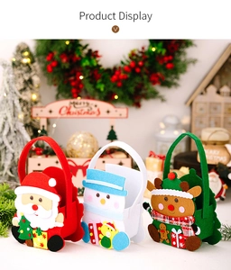 Detailed view of three festive Christmas felt gift baskets with Santa, Snowman and Reindeer