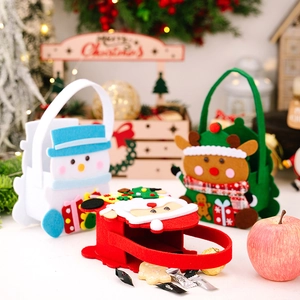 Detailed view of three 3D Christmas felt gift bags featuring Santa, Snowman, and Reindeer