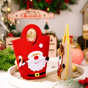 Detail of cartoon Santa Claus and reindeer felt gift bags for Christmas treats