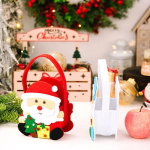 Detailed view of handmade felt Christmas gift bags with 3D Santa Claus and tree appliques