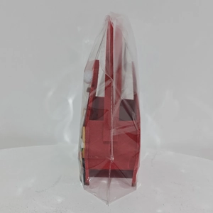 Detail view of red felt Christmas gift basket with handle in protective packaging