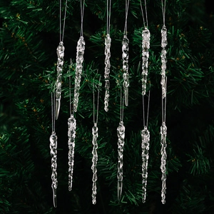 Detail showing twelve transparent acrylic icicle ornaments hanging on a green Christmas tree