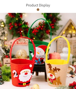 Three Christmas felt gift bags with Santa, Snowman, and Reindeer designs for holiday decor