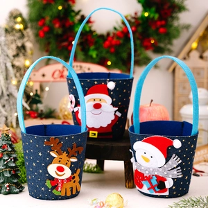 Three-piece set of blue felt Christmas gift bags with reindeer, Santa, and snowman appliques
