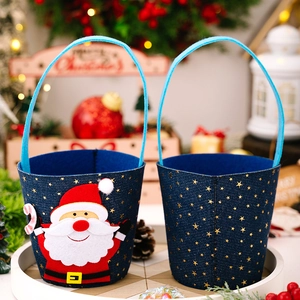 Detail view of denim Christmas gift buckets with 3D Santa applique and star patterns