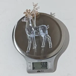Detailed view of clear acrylic Christmas reindeer ornament with gold sequins weighing 56.8g