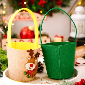 Detail of Christmas candy bags featuring cartoon reindeer and green felt textures