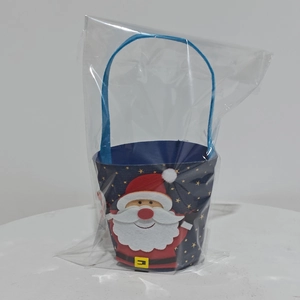 Detail view of denim Christmas gift bag with Santa Claus applique in clear packaging