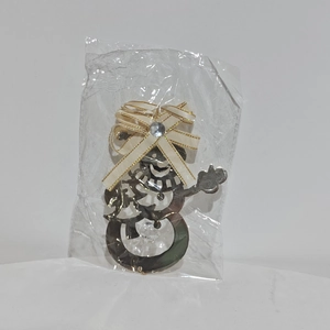 Silver snowman metal hanging ornament with a bow detail and hollowed pattern design
