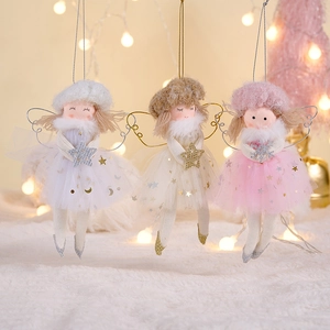 Detailed view of pink, gold, and white plush angel ornaments with sequined mesh skirts