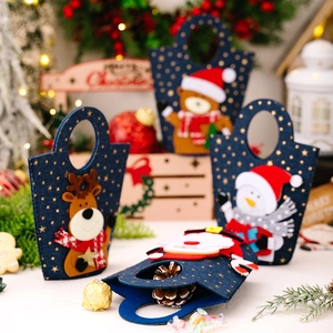 Detail view of felt Christmas gift bags with 3D Santa, deer, and snowman felt appliques