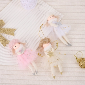 Detail of plush Christmas angel dolls with gold sequin tulle skirts and glitter stars