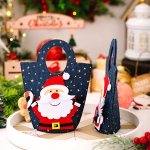 Detail of Christmas denim gift bag with Santa Claus applique and gold star patterns
