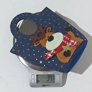 Detailed view of lightweight 34g Christmas reindeer felt gift bag with gold stars