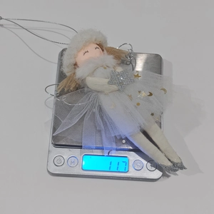 Detail of pink Christmas angel ornament with tulle skirt and stars weighing 11.7g
