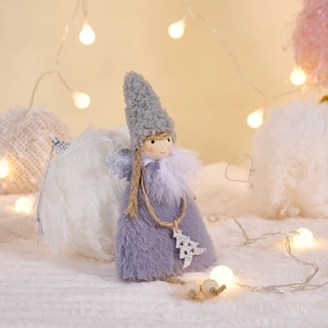 Macro detail of plush Christmas angel doll with gray knit hat and silver sequin wings