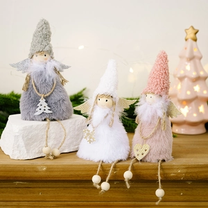 Detailed view of pink and grey plush angel Christmas ornaments with soft faux fur and wings