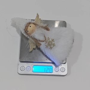 Detailed view of pink angel plush pendant on a scale weighing 12.8g for Christmas decor