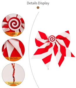 Detail of red and white striped Christmas bow with a candy centerpiece and silk texture