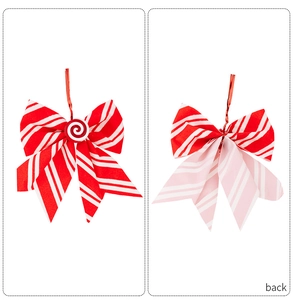 Detail of red and white striped Christmas bow with peppermint candy center and back tie