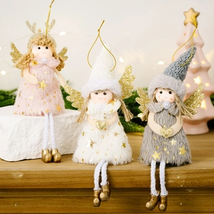 Detailed view of plush angel ornaments with glitter wings and knitted skirts for Christmas