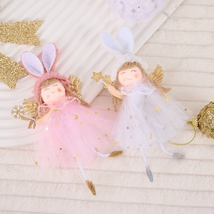 Close-up of plush rabbit angel ornaments with gold wings and star sequins mesh skirt