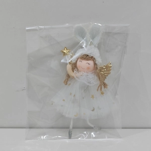 Detail of Christmas angel doll with rabbit ears and gold star wand in clear packaging
