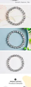 Detailed view of 8mm silver rutilated quartz bracelet with visible needle inclusions