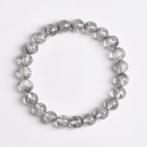 Natural 8mm silver rutilated quartz bead bracelet with intricate mineral inclusions