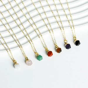 Set of 7 hexagonal crystal pendants on gold chains featuring various natural gemstones
