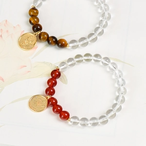 Natural crystal bracelets for Taurus and Scorpio with golden zodiac charms and round beads